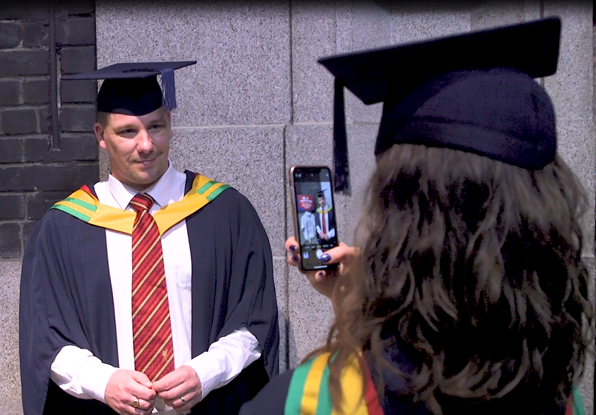 Two graduates having a conversation